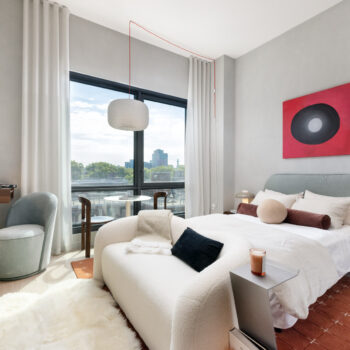 Studio bedroom with seatings areas and large window