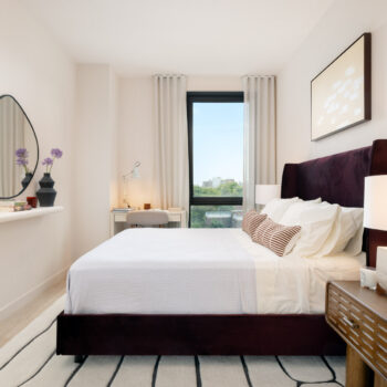 Bright modern bedroom with large window